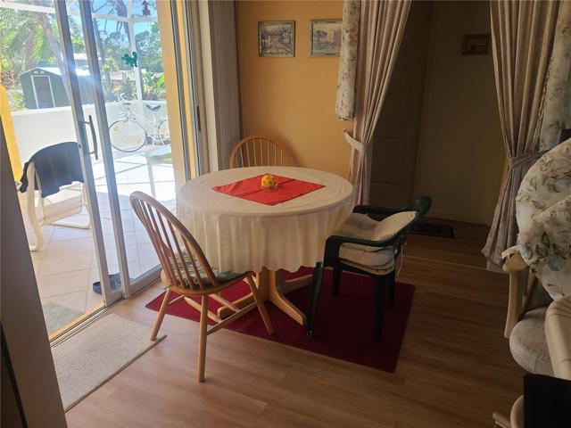 DINING AREA AND SLIDING GLASS DOOR TO THE LANAI