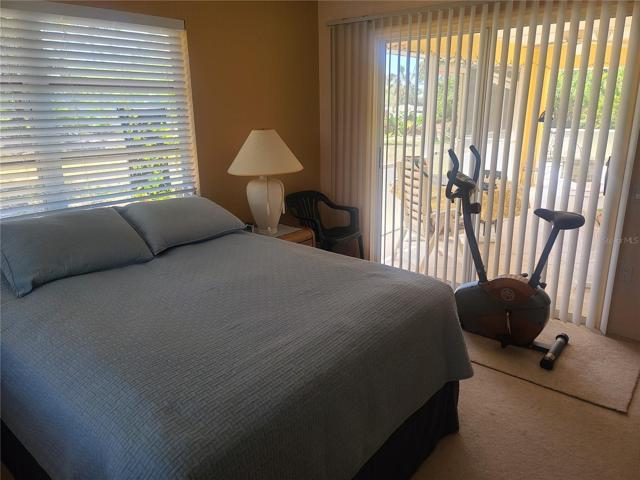 MASTER BEDROOM AND SLIDING GLASS DOOR TO THE LANAI