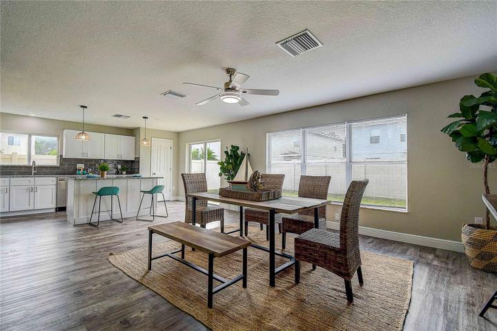 View of dining area leading into the fully remodeled kitchen.