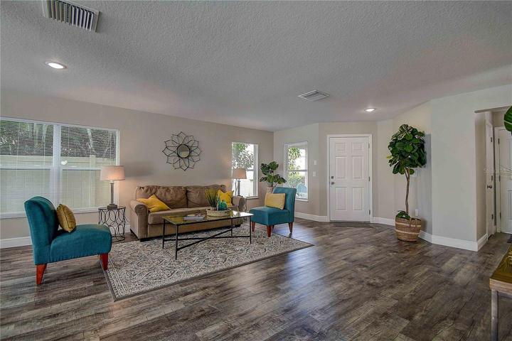 The main family room located at the front entry with large picture window.