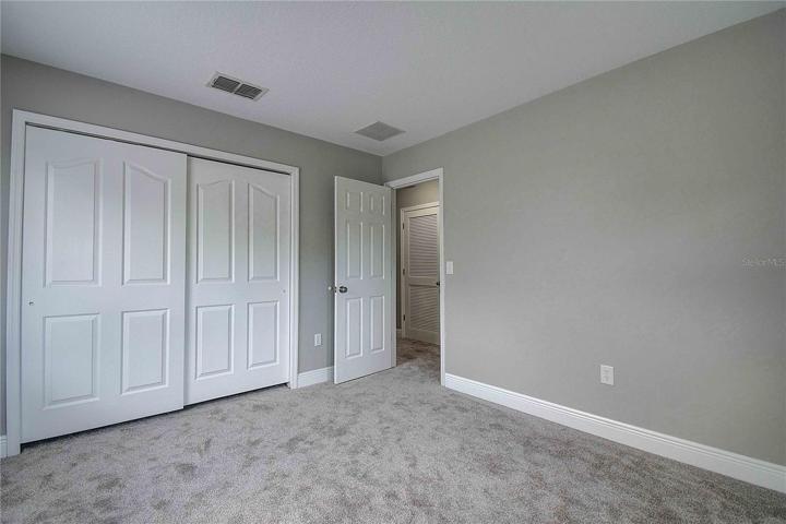 Additional view of 3rd bedroom with sliding closet/storage.