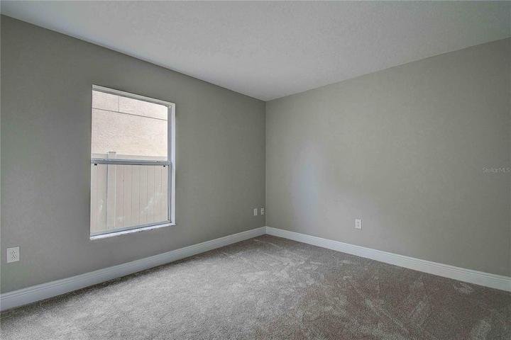 Fourth bedroom with dimensions approx 10' x 11', located on the first level.