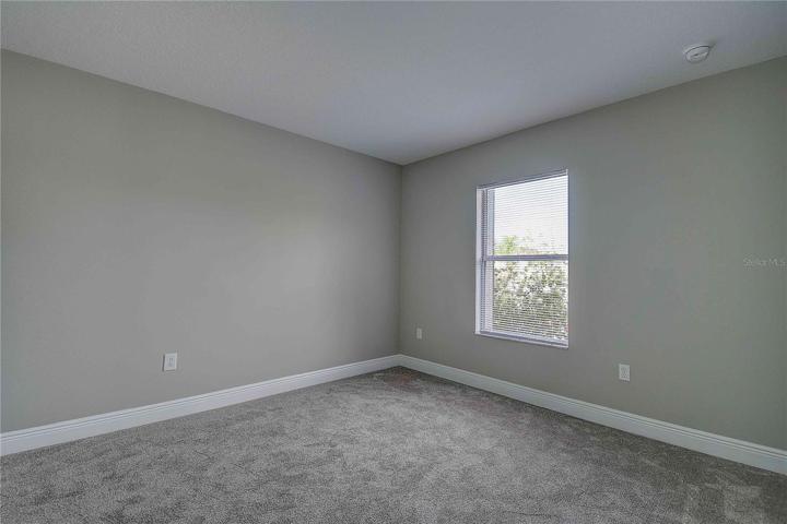 Newly painted and new carpet within the bedrooms.  View of 2nd bedroom.