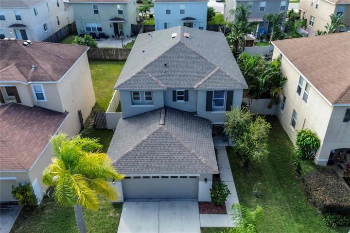 Aerial view of home/landscape, and new roof in 2023.