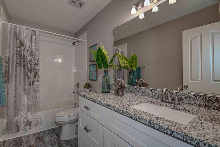 3rd full bath, located on second floor.  All newly decorated!