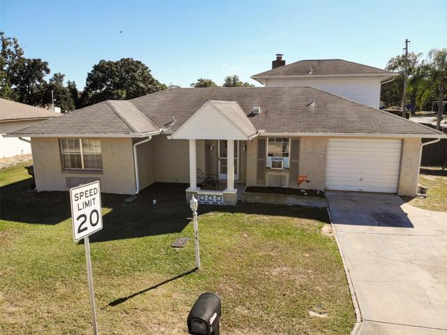 FRONT view of property on a corner lot