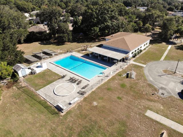 COMMUNITY POOL AND CLUBHOUSE is conveniently behind the home