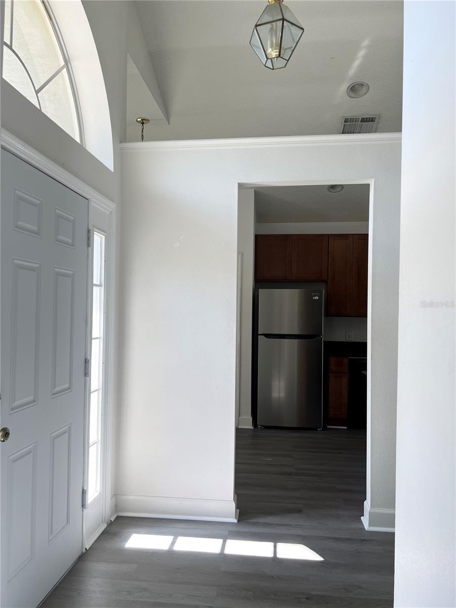 Left to entrance is kitchen