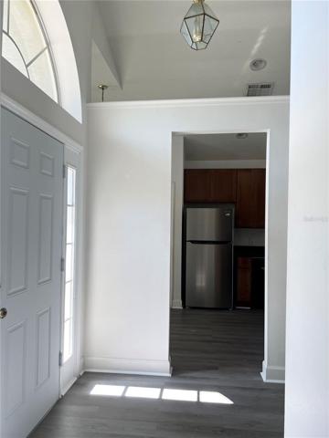 Left to entrance is kitchen