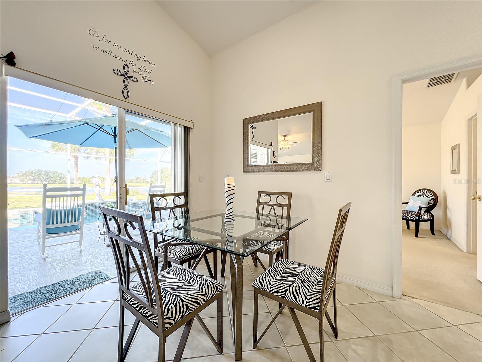 Dining room area off the patio and awesome pond and golf views