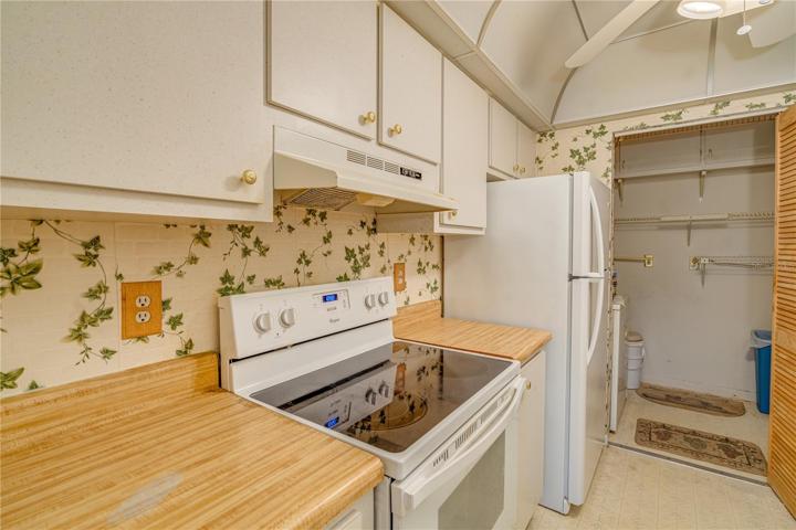 Inside washer + dryer off kitchen