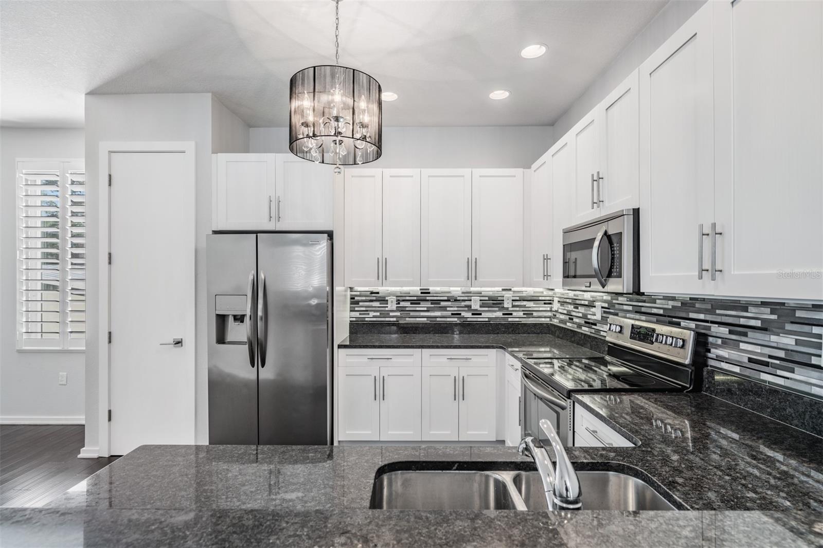 Second Floor - Family Room, Kitchen, Dining, Guest Bath and Laundry