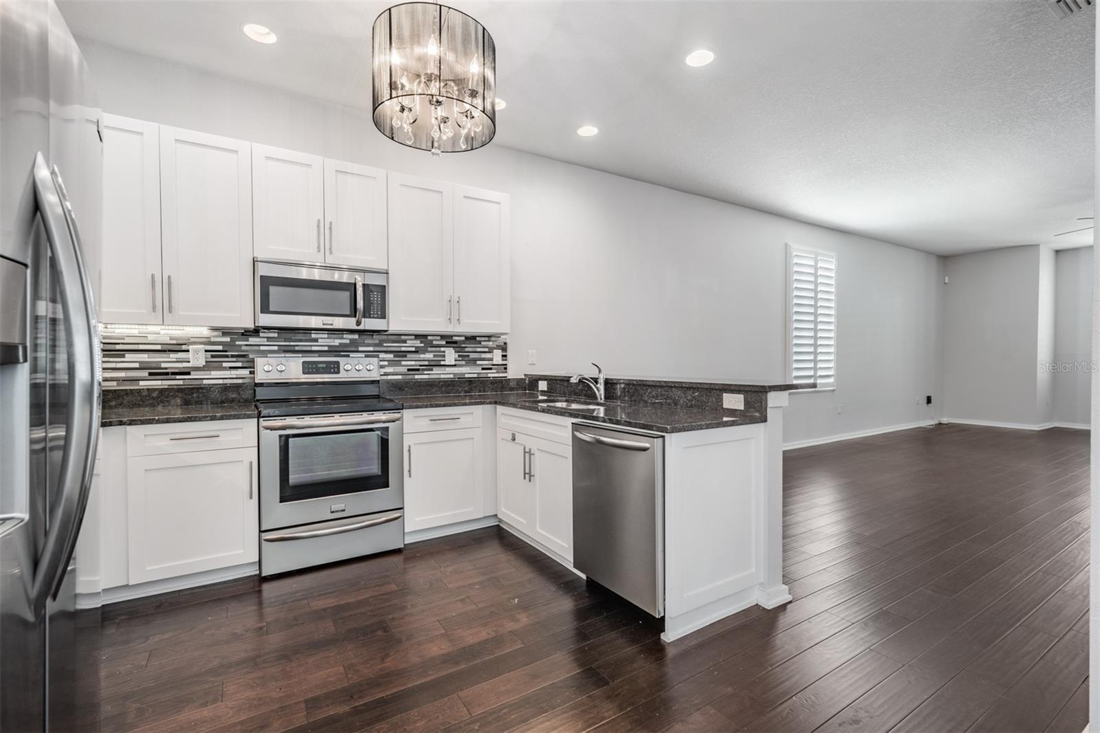 Second Floor - Family Room, Kitchen, Dining, Guest Bath and Laundry
