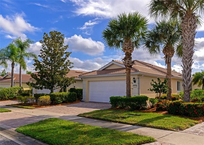 Curb appeal tile roof and paver drive.