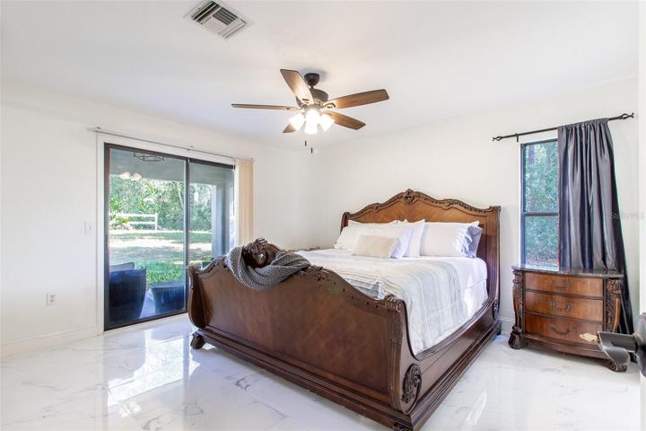 Master with sliding glass doors to the outside