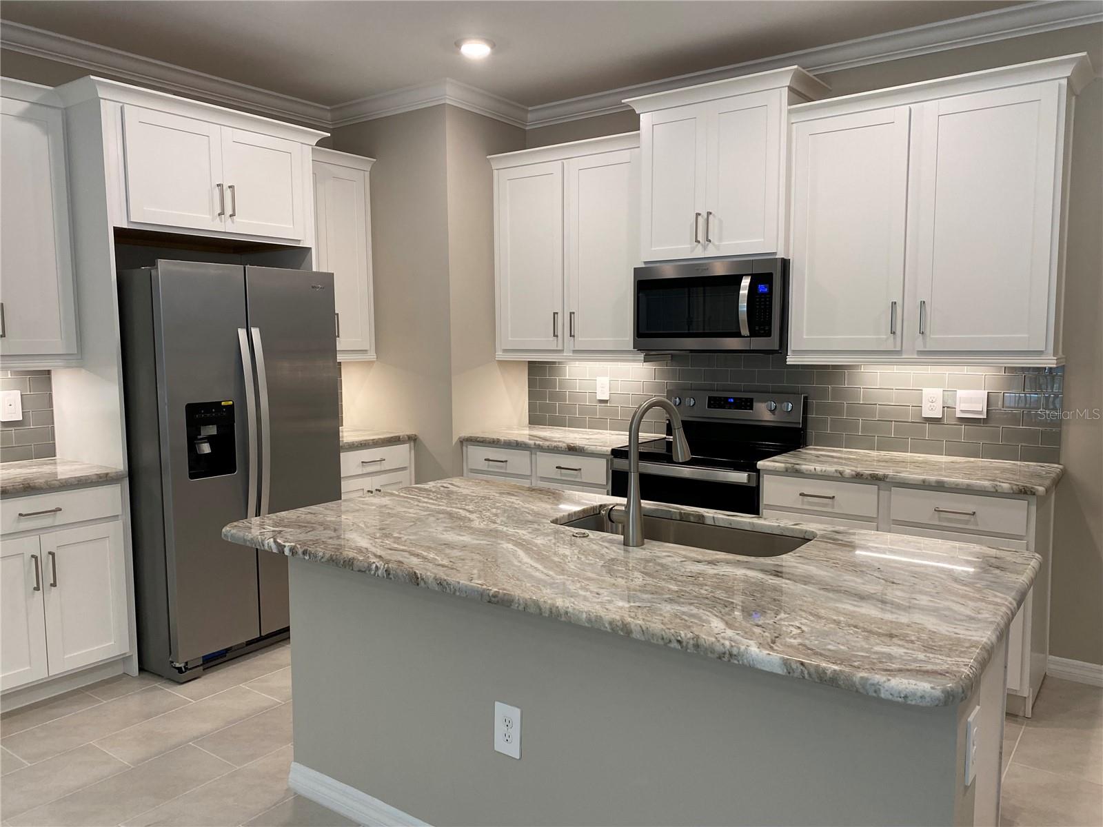 Beautiful Breakfast Bar with Granite Countertops