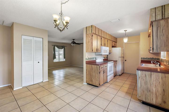 View from Dining Area to Living Area and Kitchen