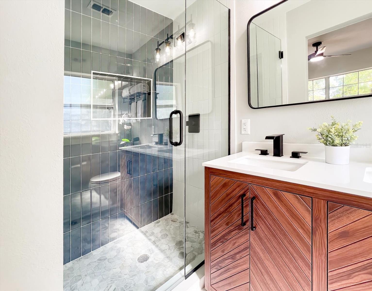 Primary shower with custom tile.