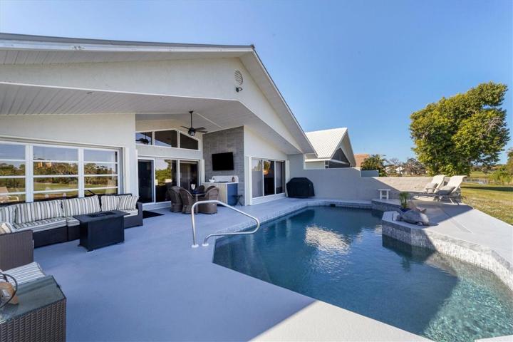 Newly resurfaced Pebble Tec pool with glass tiles, new pool heater, Pentir color changing LED lighting, new salt chlorine generator & pool heater