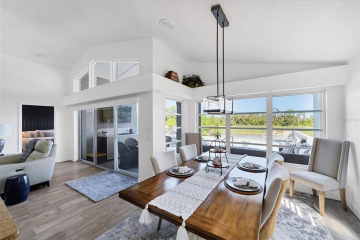 Large dining room with lots of natural lighting and water views