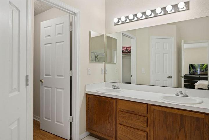 Owner's en-suite with double vanity, separate water closet, and walk-in closet.