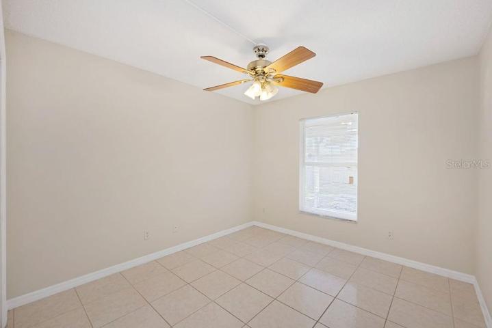 Guest Bedroom with tile flooring.