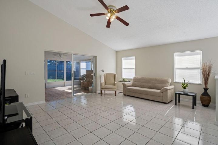 Family Room to Florida Room and fenced back yard.