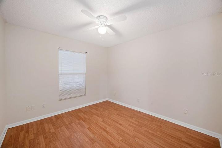 Guest Bedroom with laminate flooring.