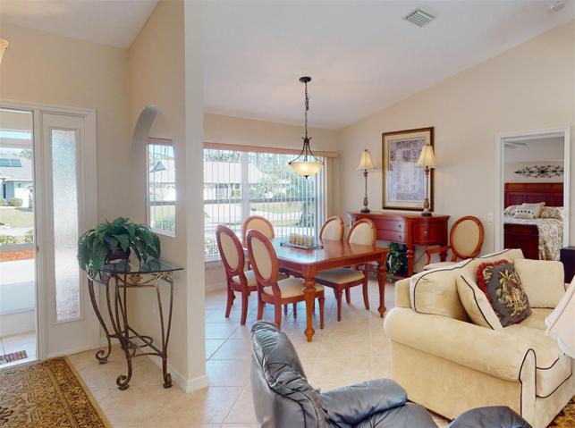 Entry way, dining area and living room view.