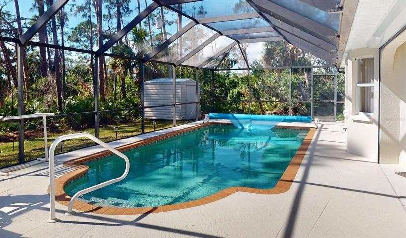 View looking down pool area.  Notice shed.