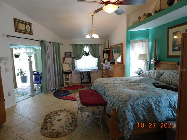 main ensuite bedroom to enclosed & covered lanai