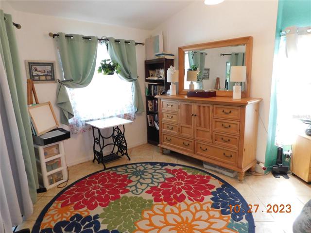 fabulous main bedroom suite opens to the lanai & pool
