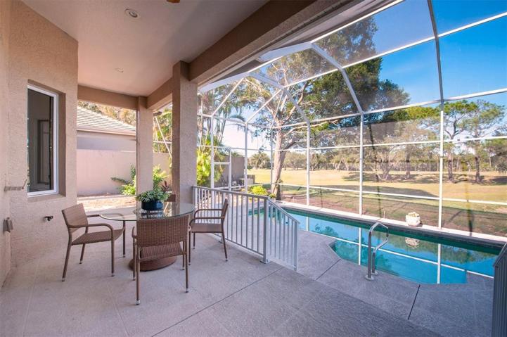 Large outdoor living space next to the sliding doors that are leading to the main living room!