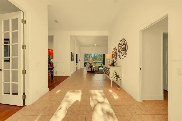 The entry has a beautiful library to the left as you enter the home!
