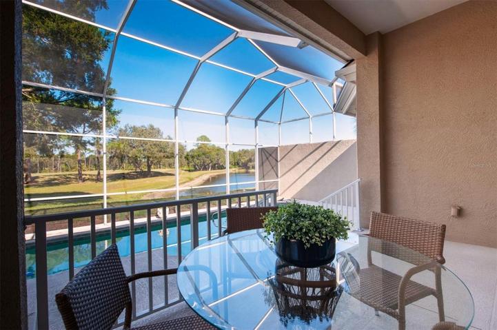 Enclosed covered porch area that is perfect for outside dining!