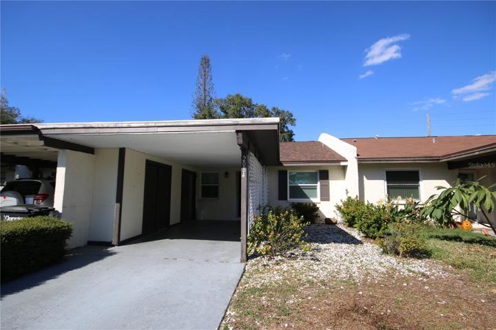 Front of Villa with a private Carport