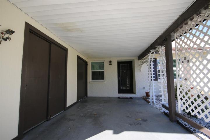 Carport with Storage Closets