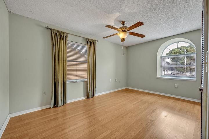 Bedroom facing front - wood flooring.