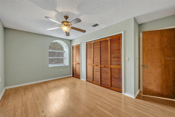 Bedroom facing front - wood flooring.