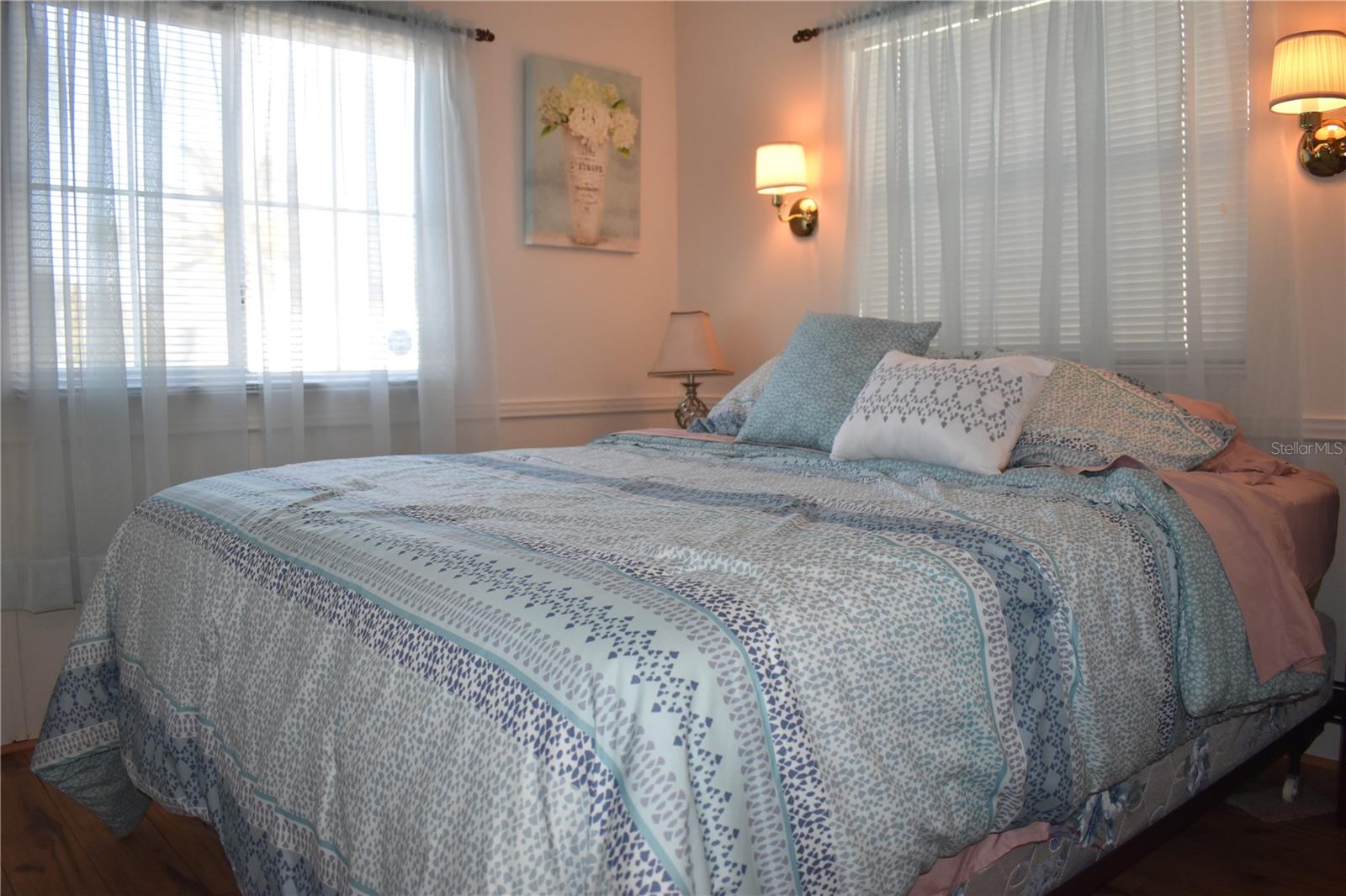 Primary bedroom overlooking rear of property - view from door way with pocket door