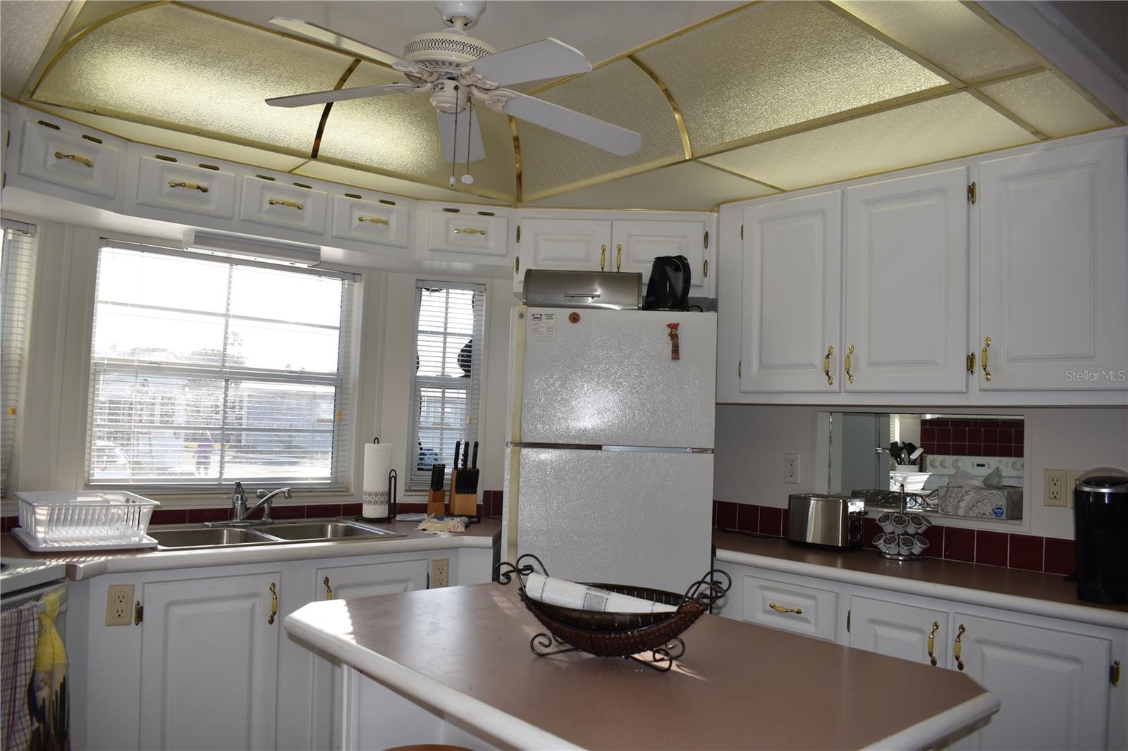 Decorative kitchen ceiling providing lots of light and decorative feature