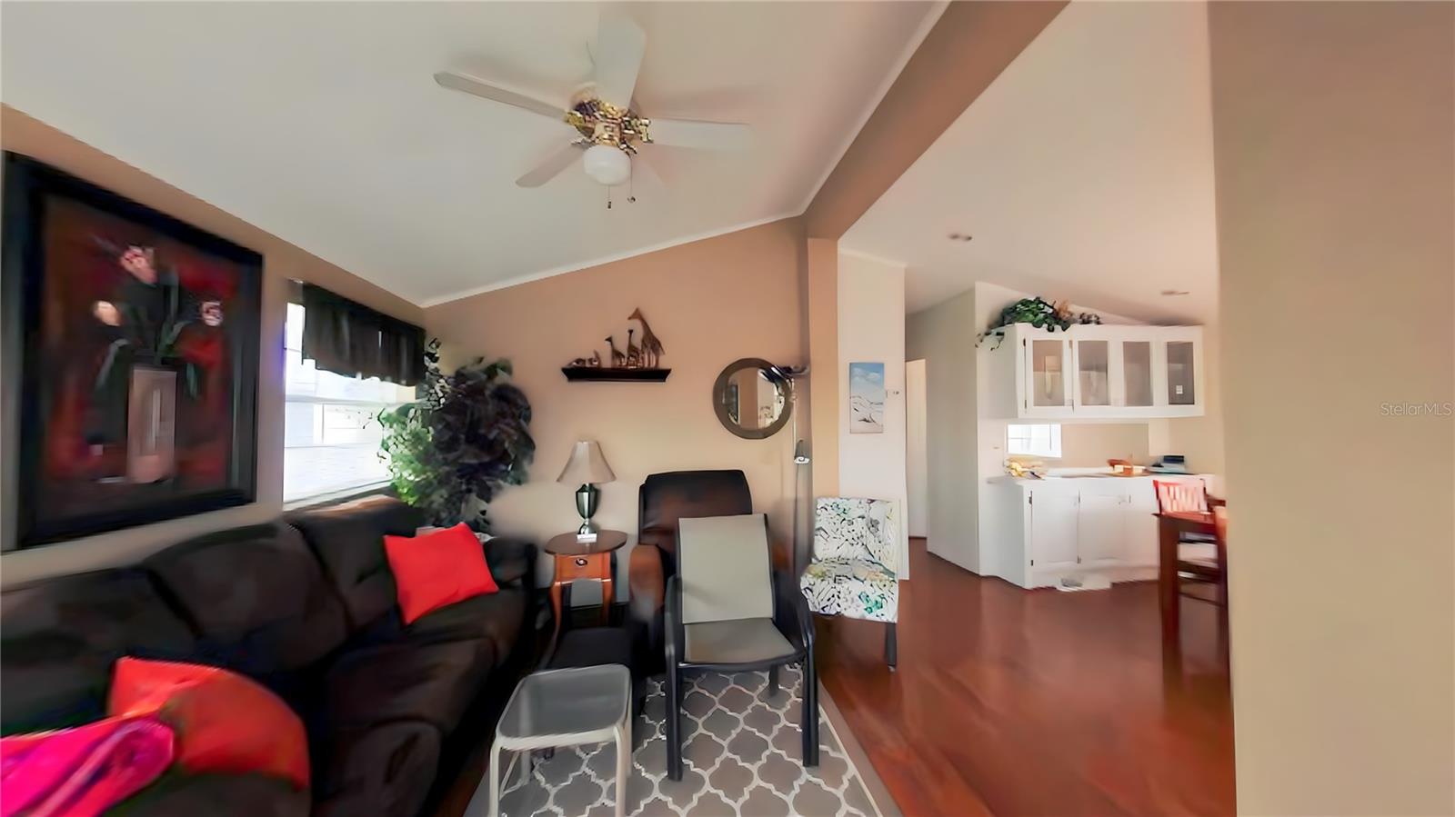 Living room with beautiful laminate flooring providing beauty and practicality