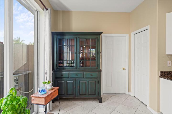 Kitchen slider, pantry and garage door.  Note: room for table if desired