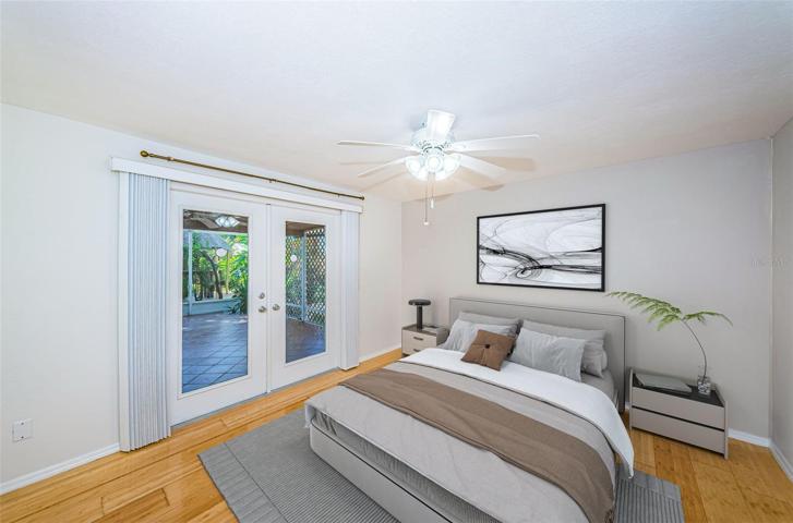 Virtually stage second bedroom with access to lanai and backyard