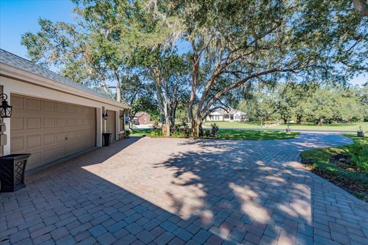 SIDE ENTRY OVERSIZED 3 CAR GARAGE WITH SECOND SIDE ENTRY PAVERED DRIVEWAY