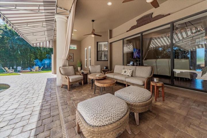 ONE OF 2 COVERED LANAI AREAS FOR OUTDOOR ENTERTAINING