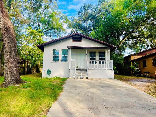 Front of home with large private parking.