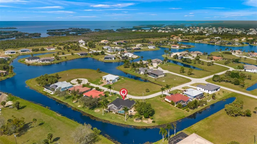 The lake meanders around the home.
