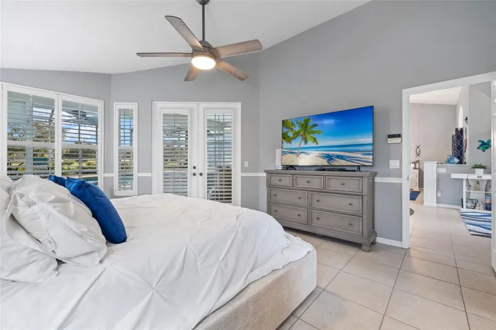 Primary bedroom with french door to the pool (and future hot tub??).
