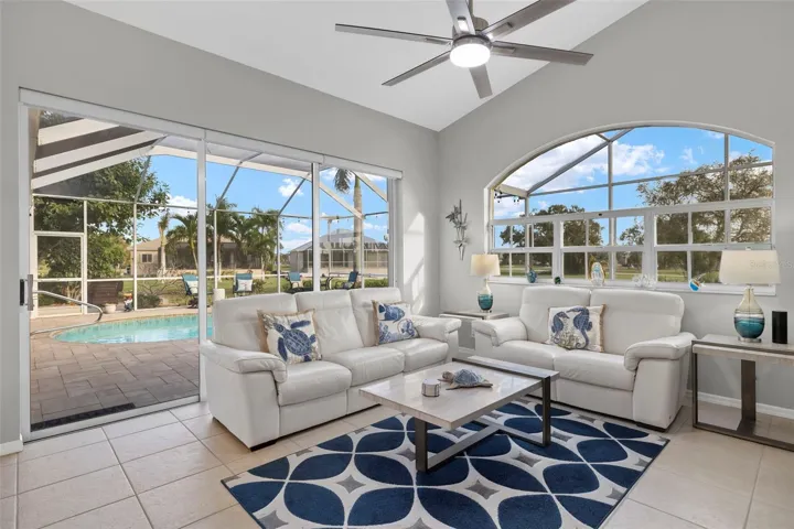 Sliding glass doors lead to the Heated Saltwater Pool, large paved lanai and a 0.45 acre lot!